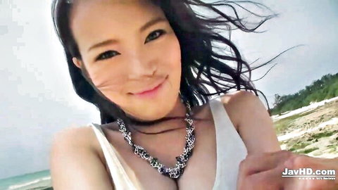 Kyouko Maki sexy Japanese stepmom smiling in white top on beach