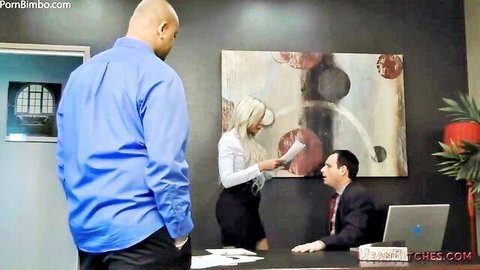 Blonde MILF mistress in office skirt humiliates suited cuckold with black bull standing by