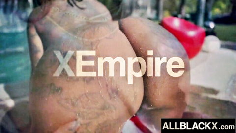 Thick ebony babe's massive tattooed ass exposed poolside