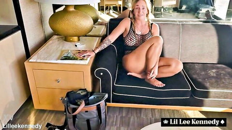 Lil Lee Kennedy in sheer black mesh lingerie, teasing solo on couch