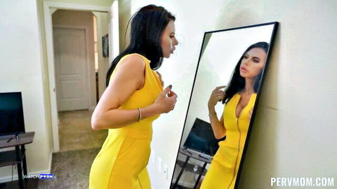 Piper Press in tight yellow dress, adjusting V-neck with big tits visible, curvy figure in mirror