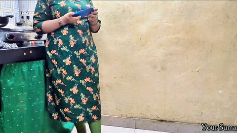 Hot Indian Desi Bhabhi caught in kitchen watching porno on phone, POV tease