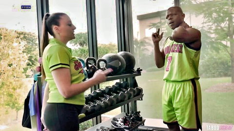 Melanie Hicks in green gym outfit dominating muscular BBC athlete