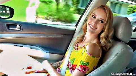 Mazzy Grace smiling in yellow floral dress on casting couch interview