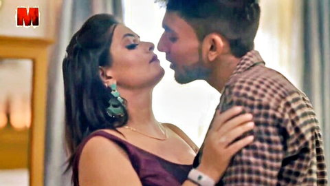 Sexy Indian babe in maroon dress passionately kissing handsome guy close-up