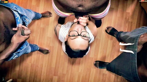 Petite Asian teen in glasses on floor surrounded by three fat black men jerking thick cocks for bukkake facial