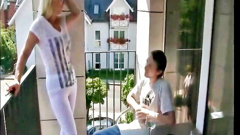 Blonde German MILF in tight white outfit teases young Asian guy on balcony