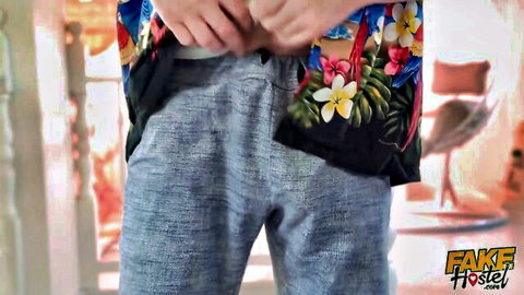 Hot guy in floral shirt unbuttoning gray pants teasing cock reveal in hostel room