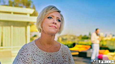 Blonde MILF Dee Williams in sexy lace top outdoor pose