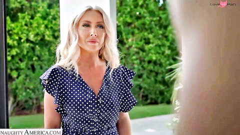 Blonde MILF in sexy polka dot dress teasing outdoors with big tits