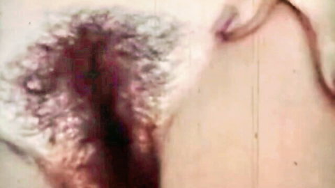 Extreme close-up of bushy hairy wet pussy with spread labia