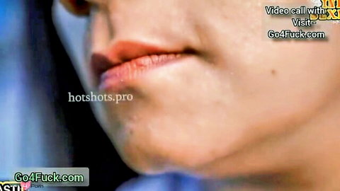 Close-up of sexy South Asian woman's plump lips pursed for cock sucking tease