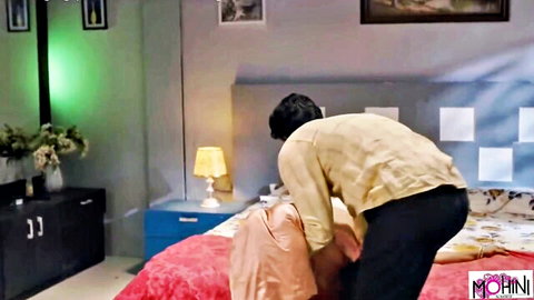 Desi man thrusting into woman from behind in doggy style on red bed