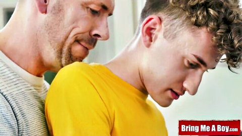 Bearded DILF holds curly-haired young twink from behind by the neck in shirts