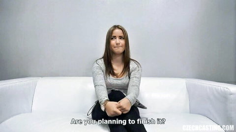 Seductive Czech escort in gray sweater during casting interview