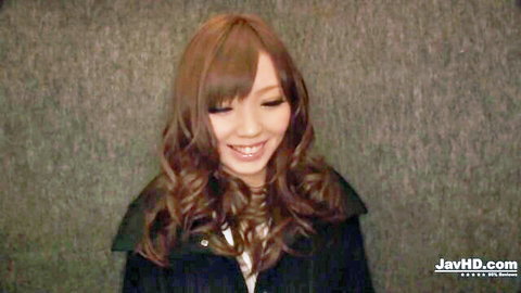 Megu Kamijo smiling in jacket for JAV threesome HD preview