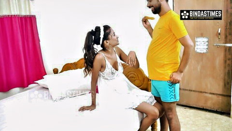 Desi wife in lace white dress with man in yellow shirt and blue shorts in intimate Indian scene