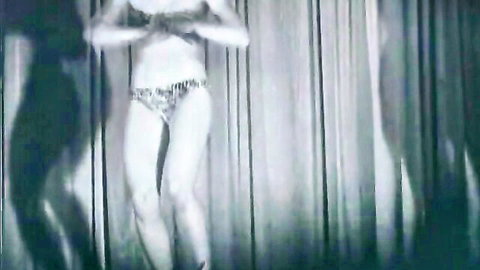 Vintage burlesque softcore tease with smoking fetish, slim dancer pose