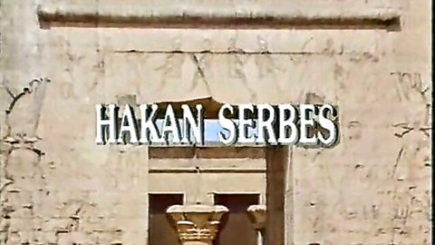 Vintage porn title screen with Hakan Serbes watermark over ancient temple arches and lamps