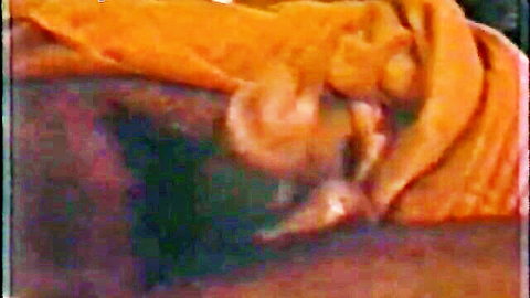 Ebony pussy spread wide and fingered closeup with wet labia on orange sheet
