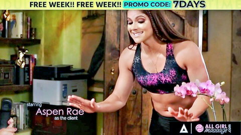 Aspen Rae poses in tight sports bra showing toned abs and cleavage for all girl massage promo