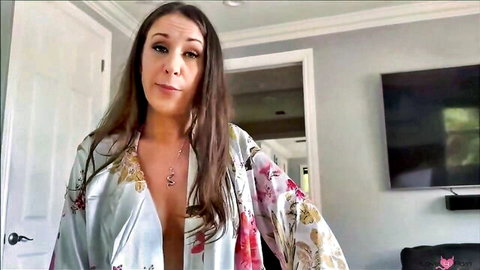 Busty MILF housewife teasing in open floral silk robe showing deep cleavage