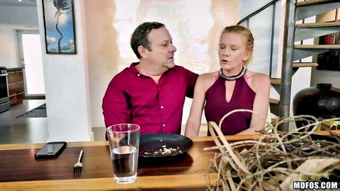 Skinny blonde with small tits flirts closely with older man at kitchen table