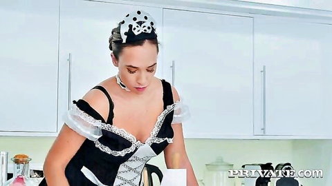 Briana Bounce as busty maid in black lingerie dress, showing cleavage