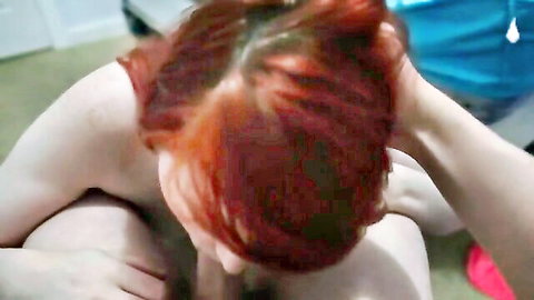 Fiery redhead performing intense POV blowjob with passion