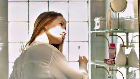 Amalia Davis and Stella Cardo in sensual bathroom lesbian tease