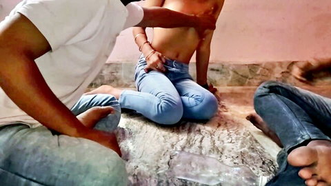 South Asian woman in tight blue jeans gets bare tits groped by man in white shirt as friend touches her