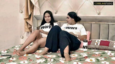 Two Indian women in Aashi Sis t-shirts on bed, uncut hot Hindi scene
