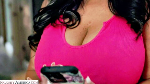 Hot MILF in pink ribbed top showing deep cleavage and big tits