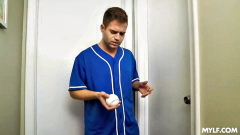 Handsome stepson in blue baseball jersey holding ball for MILF seduction