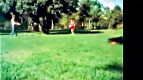 Vintage outdoor romp with pigtails girl in red dress and small tits friend on green grass