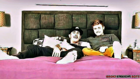 Two athletic guys lounging on bed in Broke Straight Boys amateur gay scene