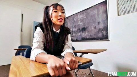 Elle Lee in sexy schoolgirl uniform at desk, Asian beauty with pigtails