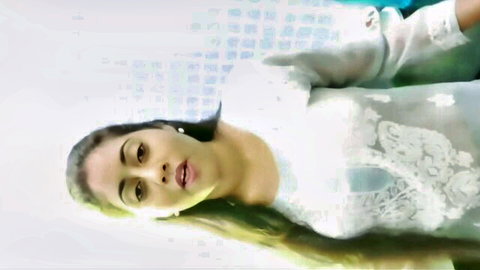 Seductive South Asian beauty in sheer lace blouse gazes up with parted lips teasing blowjob