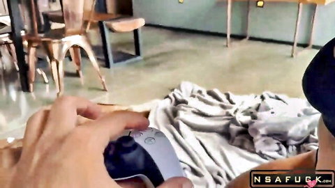 Tanned babe spreads legs wide exposing shaved pussy while guy holds PS5 controller teasing her wet slit POV