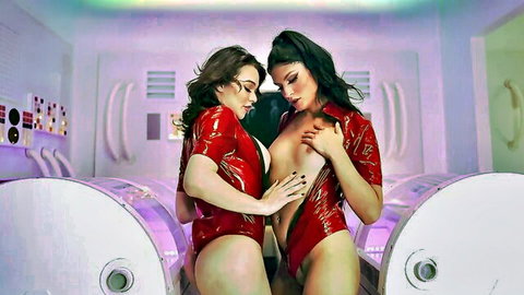 Emma Rose and Zariah in red latex bodysuits, dominating embrace in erotic sci-fi scene