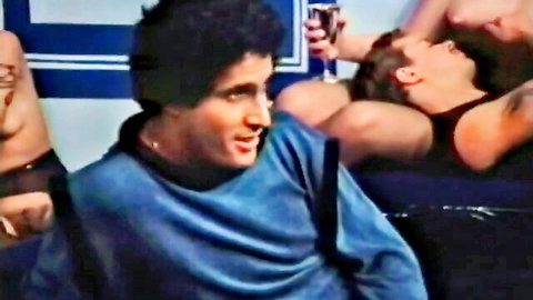 Vintage porn thumbnail of muscular men in blue swimsuit scene sharing drinks