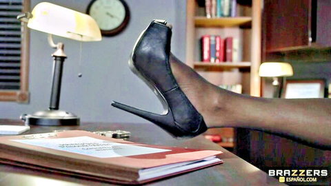 Ariella Ferrera's sexy legs in black stockings and high heels on desk