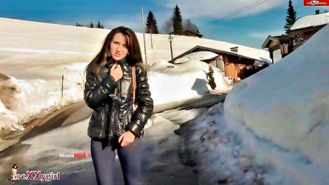 Hot brunette teen slut teases in tight pants and jacket on snowy mountain path