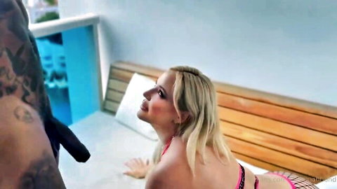 Blonde curvy MILF with huge fake tits kneels ass-up on poolside bench for muscular black bull's massive cock