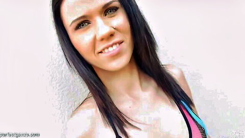 Smiling European hottie with long dark hair in pink top showing cleavage