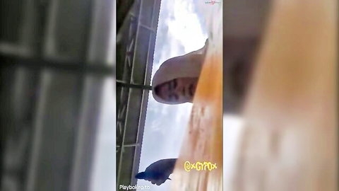Indonesian woman in hijab in blurry outdoor adult scene