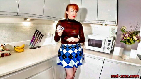 Red Xxx busty redhead cougar in sexy skirt posing in kitchen