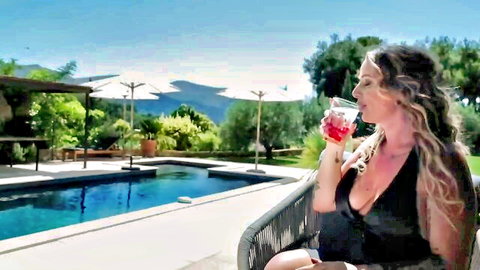 Giulia sips a drink poolside in black dress, outdoor tease by Jacquie Et Michel TV