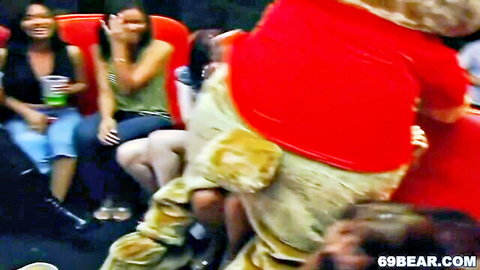Asian women laughing in CFNM orgy with Dancing Bear costume bulge