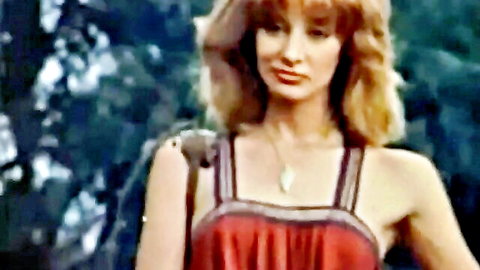 Vintage blonde retro pornstar in sexy red dress outdoors